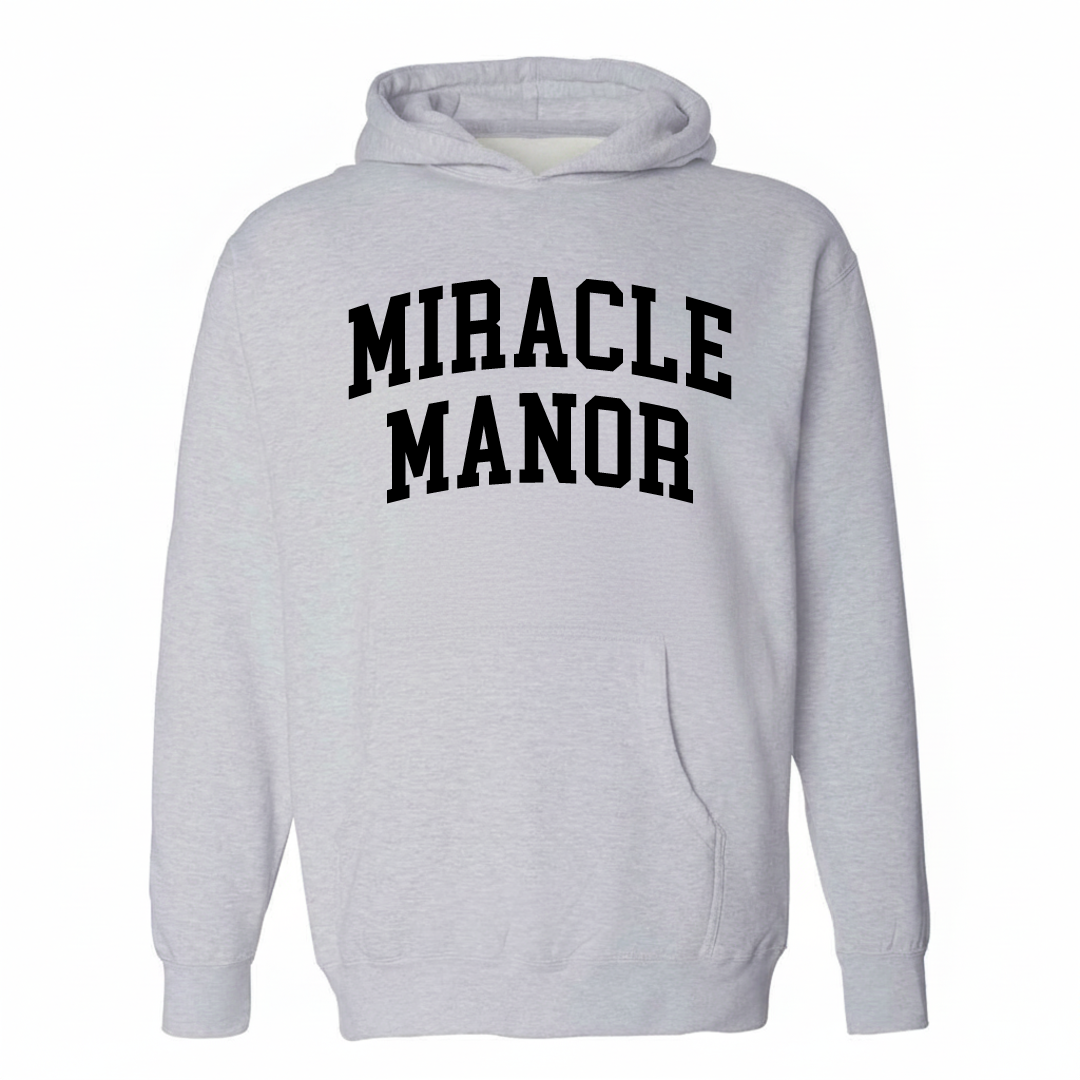 Heather-gray hoodie with the Miracle Manor varsity arched lettering design on the chest.