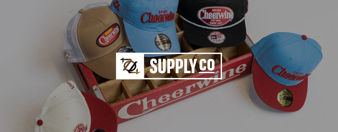 Custom Cheerwine hats in a Cheerwine crate, made by 704 Supply Co.